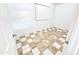 Spacious, neutrally painted room featuring a checker-patterned floor and a window with blinds at 7202 N 36Th Ave, Phoenix, AZ 85051