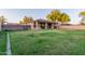 Spacious back yard features a covered patio and ample room for outdoor activities at 7607 W Keim Dr, Glendale, AZ 85303