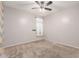 Inviting bedroom with neutral tones, featuring a ceiling fan and a bright window at 7607 W Keim Dr, Glendale, AZ 85303
