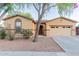 Charming single-story home with a two-car garage and well-maintained landscaping at 7607 W Keim Dr, Glendale, AZ 85303