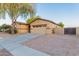 Single-story home featuring desert landscaping, a two-car garage, and neutral tones at 7607 W Keim Dr, Glendale, AZ 85303