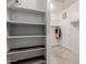 Well-organized walk-in closet featuring built-in shelving and rod, offering plenty of storage at 7607 W Keim Dr, Glendale, AZ 85303