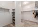 Large walk-in closet with shelving and hanging racks provides organized storage solutions at 7607 W Keim Dr, Glendale, AZ 85303
