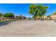 Outdoor basketball court with a hoop and surrounding trees in a well-maintained community setting at 7769 W Bonitos Dr, Phoenix, AZ 85035