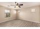 This bedroom features wood look floors and multiple windows for lots of natural light at 7769 W Bonitos Dr, Phoenix, AZ 85035