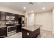 Spacious kitchen with stainless appliances and an island at 7769 W Bonitos Dr, Phoenix, AZ 85035