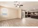 Open floor plan with tile flooring connects the living area to the kitchen at 7769 W Bonitos Dr, Phoenix, AZ 85035
