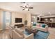 Open-concept living area with cozy furnishings and an adjacent kitchen at 7769 W Bonitos Dr, Phoenix, AZ 85035