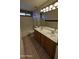 Bathroom with double sink vanity, tile flooring, and shower/tub combo at 8014 W Beaubien Dr, Peoria, AZ 85382