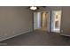 Bedroom with carpet flooring and bathroom access through open doorway at 8014 W Beaubien Dr, Peoria, AZ 85382