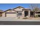 Single story home featuring a two car garage and desert landscaping at 8014 W Beaubien Dr, Peoria, AZ 85382