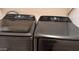 Close-up on the modern black washer and dryer with various settings and features at 8014 W Beaubien Dr, Peoria, AZ 85382