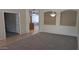 Open living room showcasing the decorative lighting, tile, and carpet at 8014 W Beaubien Dr, Peoria, AZ 85382