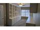 Office with built-in shelving, cabinets, and a ceiling fan at 8014 W Beaubien Dr, Peoria, AZ 85382