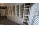 An office with custom shelving and cabinets at 8014 W Beaubien Dr, Peoria, AZ 85382