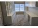 Well-lit office area with built-in shelving and cabinetry at 8014 W Beaubien Dr, Peoria, AZ 85382