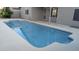 Refreshing pool surrounded by a concrete deck and a covered patio area at 8014 W Beaubien Dr, Peoria, AZ 85382