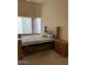 Comfortable bedroom featuring natural light and classic wood furniture at 840 W Crooked Stick Dr, Casa Grande, AZ 85122
