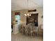 Formal dining area with chandelier, glass-topped table, and decorative wall art at 840 W Crooked Stick Dr, Casa Grande, AZ 85122