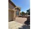 Home with paver patio and desert landscaping, stone veneer accents, and neutral-colored siding at 840 W Crooked Stick Dr, Casa Grande, AZ 85122