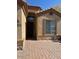 Home featuring stone accents, a covered entryway, and a paver walkway to the front door at 840 W Crooked Stick Dr, Casa Grande, AZ 85122