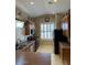 Bright kitchen with wood cabinetry, a corner window over the sink, and black appliances at 840 W Crooked Stick Dr, Casa Grande, AZ 85122
