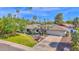 Inviting home with well-maintained landscaping, mature trees, an expansive driveway, and a charming front yard at 8582 E Via De Dorado --, Scottsdale, AZ 85258