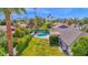 Expansive property featuring a pool, lush green lawn, mature landscaping, and mountain views at 8582 E Via De Dorado --, Scottsdale, AZ 85258