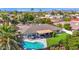 Backyard pool and patio area with BBQ, lush greenery, mature trees, and partial roof cover provide private outdoor living space at 8582 E Via De Dorado --, Scottsdale, AZ 85258