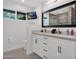 Bathroom features double sinks, modern fixtures, a TV and large mirror for a spa-like experience at 8582 E Via De Dorado --, Scottsdale, AZ 85258
