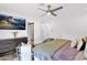 Comfortable bedroom boasts a ceiling fan, TV, a dresser and backyard view from the sliding glass door at 8582 E Via De Dorado --, Scottsdale, AZ 85258