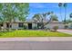 Charming single-story home featuring a well-manicured lawn and mature trees, creating a welcoming curb appeal at 8582 E Via De Dorado --, Scottsdale, AZ 85258