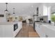 Bright, spacious kitchen features white cabinets, modern appliances, island, and an open floor plan at 8582 E Via De Dorado --, Scottsdale, AZ 85258