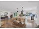 Open kitchen boasts a large island with seating, stainless steel appliances, and hardwood floors at 8582 E Via De Dorado --, Scottsdale, AZ 85258