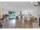 Open-concept living space with wood floors, a gourmet kitchen, and sliding glass doors to the backyard at 8582 E Via De Dorado --, Scottsdale, AZ 85258