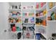 Walk-in pantry provides generous storage space with organized shelving and storage baskets at 8582 E Via De Dorado --, Scottsdale, AZ 85258