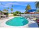 Beautiful swimming pool with lounge chairs, set against a backdrop of palm trees and blue skies at 8582 E Via De Dorado --, Scottsdale, AZ 85258