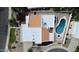 Aerial view of a house with a pool, patio seating area, desert landscaping and terracotta-colored roofs at 9208 N 83Rd St, Scottsdale, AZ 85258