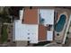 Bird's eye view of house with pool, patio seating and desert landscaping with terracotta-colored roofs at 9208 N 83Rd St, Scottsdale, AZ 85258