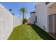 Turfed backyard with fence and gate at 9208 N 83Rd St, Scottsdale, AZ 85258
