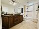 Bright bathroom with a large mirror, a shower-tub combination, and a stylish vanity at 9208 N 83Rd St, Scottsdale, AZ 85258