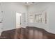 Bedroom featuring hardwood floors, white walls, and plantation shutters at 9208 N 83Rd St, Scottsdale, AZ 85258