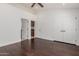 Spacious bedroom with hardwood floors and multiple doors leading to closets and other rooms in the house at 9208 N 83Rd St, Scottsdale, AZ 85258