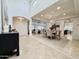 Light-filled foyer features beautiful tile flooring, arched entryways, and modern lighting at 9208 N 83Rd St, Scottsdale, AZ 85258