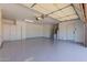Spacious two car garage with epoxy flooring, built in storage, overhead lighting, and an insulated garage door at 9208 N 83Rd St, Scottsdale, AZ 85258