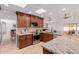 Beautiful kitchen with stainless steel appliances, granite countertops, and views into the living room at 9208 N 83Rd St, Scottsdale, AZ 85258