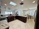 Well-appointed kitchen offers granite countertops, stainless appliances, and seamless living room views at 9208 N 83Rd St, Scottsdale, AZ 85258