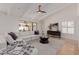 Inviting living room featuring a comfortable white sectional, neutral decor, and a sliding glass door at 9208 N 83Rd St, Scottsdale, AZ 85258