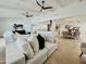 Spacious living room boasts high ceilings, neutral tones, and seamless flow to dining area at 9208 N 83Rd St, Scottsdale, AZ 85258