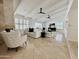 Bright living room with comfortable seating, fireplace, tile flooring, and beamed ceilings at 9208 N 83Rd St, Scottsdale, AZ 85258